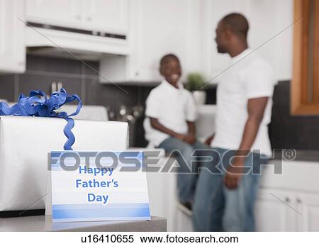 USA, Illinois, Metamora, Father's day gift and card, father and son (6-7) in background View Large Photo Image Stock Photography - USA, Illinois, Metamora, Father's day gift and card, father and son (6-7) in background. Fotosearch