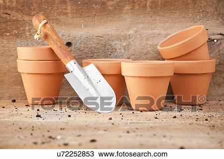 USA, Illinois, Metamora, Flower pots and shovel in background View Large Photo Image Stock Image - USA, Illinois, Metamora, Flower pots and shovel in background. Fotosearch