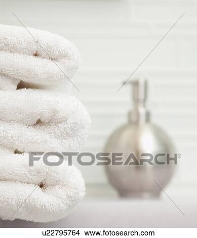 USA, Illinois, Metamora, focus on stack of towels in bathroom View Large Photo Image Picture - USA, Illinois, Metamora, focus on stack of towels in bathroom. Fotosearch