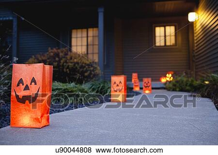 Stock Photo - USA, Illinois, Metamora, Footpath in garden decorated for Halloween. Fotosearch