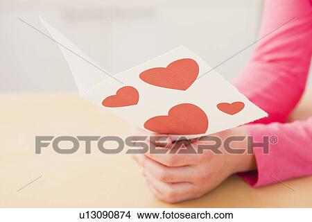 USA, Illinois, Metamora, Girl (10-11) reading greeting card with hearts View Large Photo Image Picture - USA, Illinois, Metamora, Girl (10-11) reading greeting card with hearts. Fotosearch