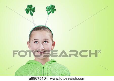 Picture - USA, Illinois, Metamora, Girl (10-11) wearing hairband with shamrocks. Fotosearch