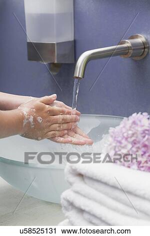 USA, Illinois, Metamora, girl (12-13) washing hands View Large Photo Image Stock Image - USA, Illinois, Metamora, girl (12-13) washing hands. Fotosearch