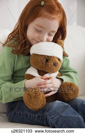 USA, Illinois, Metamora, Girl (4-5) hugging teddy bear View Large Photo Image Stock Image - USA, Illinois, Metamora, Girl (4-5) hugging teddy bear. Fotosearch