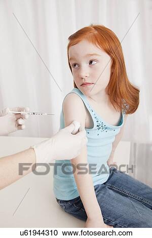 USA, Illinois, Metamora, Girl (4-5) having vaccination in doctor' office View Large Photo Image Stock Image - USA, Illinois, Metamora, Girl (4-5) having vaccination in doctor' office. Fotosearch