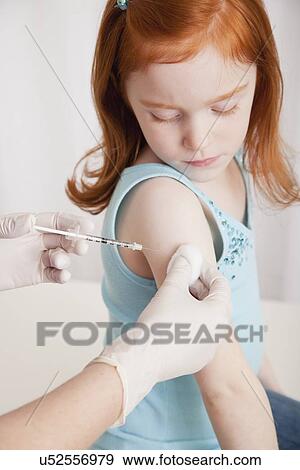 USA, Illinois, Metamora, Girl (4-5) having vaccination in doctor' office View Large Photo Image Stock Photo - USA, Illinois, Metamora, Girl (4-5) having vaccination in doctor' office. Fotosearch