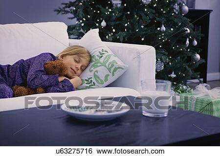 Stock Photograph - USA, Illinois, Metamora, Girl (6-7) waiting for Santa. Fotosearch