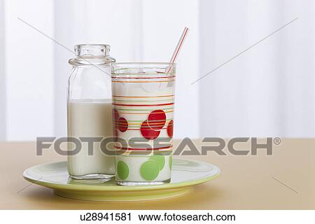 USA, Illinois, Metamora, Glass of milk and milk bottle on table View Large Photo Image Stock Image - USA, Illinois, Metamora, Glass of milk and milk bottle on table. Fotosearch