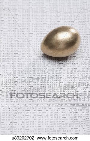 Stock Image - USA, Illinois, Metamora, Golden egg on newspaper stock quotes. Fotosearch