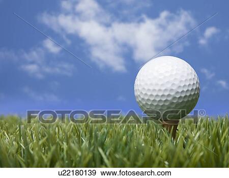 Stock Photo - USA, Illinois, Metamora, Golf ball on tee. Fotosearch