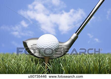 Stock Photograph - USA, Illinois, Metamora, Golf club and golf ball on tee. Fotosearch