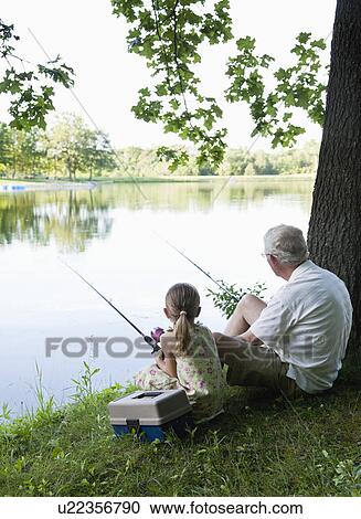 USA, Illinois, Metamora, grandfather and granddaughter (4-5) sitting at edge of lake View Large Photo Image Stock Image - USA, Illinois, Metamora, grandfather and granddaughter (4-5) sitting at edge of lake. Fotosearch
