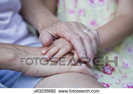 USA, Illinois, Metamora, grandmother and granddaughter (4-5) holding hands View Large Photo Image Stock Image - USA, Illinois, Metamora, grandmother and granddaughter (4-5) holding hands. Fotosearch
