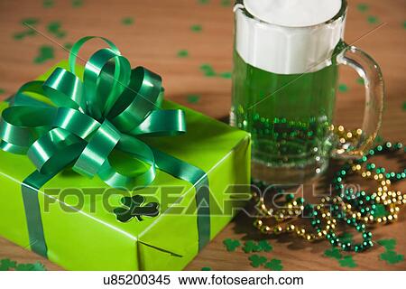 Stock Photography - USA, Illinois, Metamora, Green beer and gift box. Fotosearch