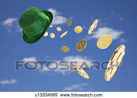 USA, Illinois, Metamora, Green hat and golden coins flying in sky View Large Photo Image Stock Photo - USA, Illinois, Metamora, Green hat and golden coins flying in sky. Fotosearch