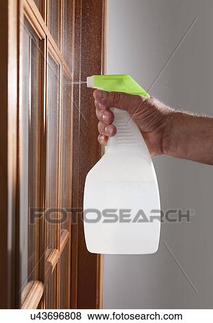 Stock Photo - USA, Illinois, Metamora, hand cleaning window. Fotosearch
