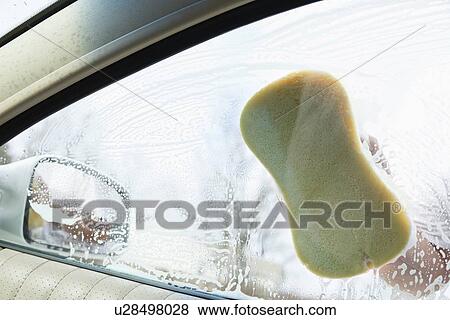 USA, Illinois, Metamora, Hand washing car window View Large Photo Image Stock Photo - USA, Illinois, Metamora, Hand washing car window. Fotosearch