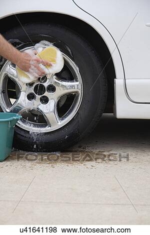 Stock Photo - USA, Illinois, Metamora, Hand washing car. Fotosearch