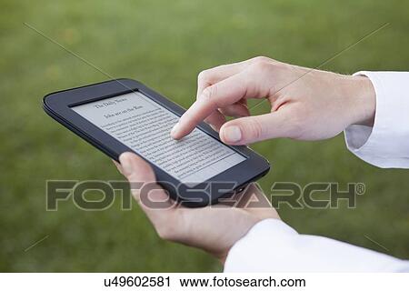 USA, Illinois, Metamora, hands holding e-book View Large Photo Image Stock Image - USA, Illinois, Metamora, hands holding e-book. Fotosearch