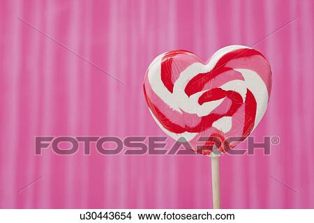 USA, Illinois, Metamora, Heart shaped lollipop View Large Photo Image Picture - USA, Illinois, Metamora, Heart shaped lollipop. Fotosearch