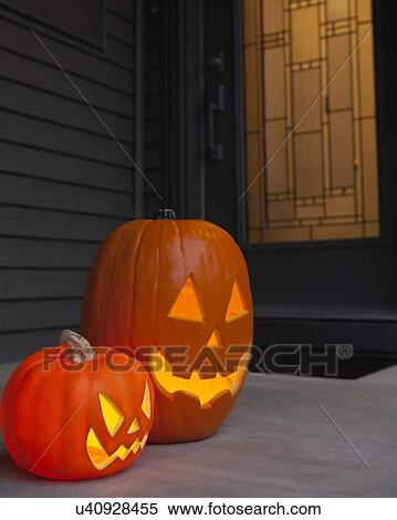 USA, Illinois, Metamora, Jack O'lanterns in front of door View Large Photo Image Stock Photography - USA, Illinois, Metamora, Jack O'lanterns in front of door. Fotosearch