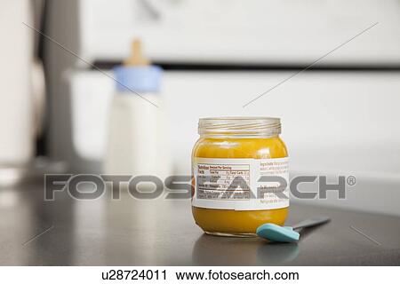 Stock Image - USA, Illinois, Metamora, Jar with baby food. Fotosearch