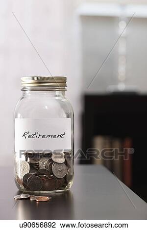 Stock Image - USA, Illinois, Metamora, Jars with savings. Fotosearch