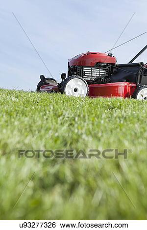 Stock Photograph - USA, Illinois, Metamora, Lawn mower. Fotosearch