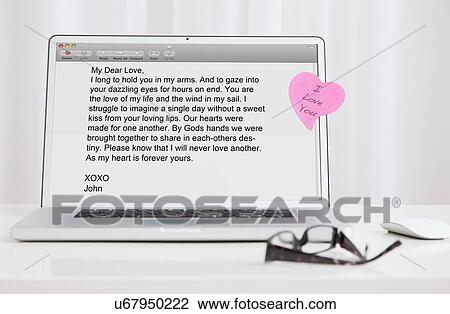 Stock Image - USA, Illinois, Metamora, Love letter on laptop screen. Fotosearch