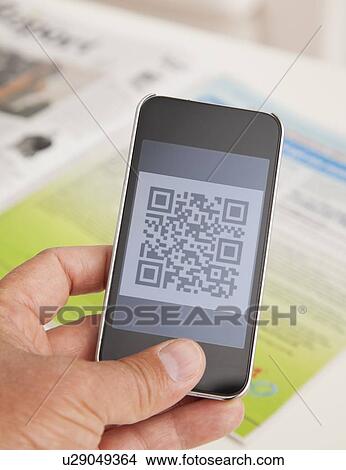 USA, Illinois, Metamora, Male hand holding smart phone displaying code View Large Photo Image Picture - USA, Illinois, Metamora, Male hand holding smart phone displaying code. Fotosearch