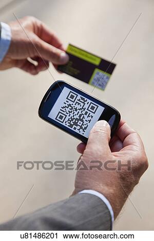 USA, Illinois, Metamora, Man using smart phone device View Large Photo Image Stock Image - USA, Illinois, Metamora, Man using smart phone device. Fotosearch