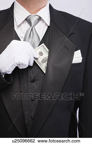USA, Illinois, Metamora, Man wearing tuxedo holding hundred dollar banknote, mid section View Large Photo Image Stock Image - USA, Illinois, Metamora, Man wearing tuxedo holding hundred dollar banknote, mid section. Fotosearch