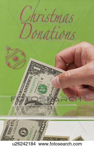 USA, Illinois, Metamora, Man's hand giving donation View Large Photo Image Picture - USA, Illinois, Metamora, Man's hand giving donation. Fotosearch