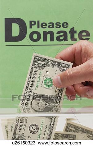 USA, Illinois, Metamora, Man's hand giving donation View Large Photo Image Stock Image - USA, Illinois, Metamora, Man's hand giving donation. Fotosearch