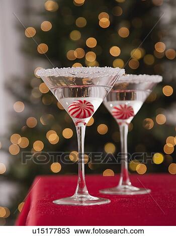 USA, Illinois, Metamora, Martini glasses with candies inside against illuminated Christmas tree View Large Photo Image Stock Image - USA, Illinois, Metamora, Martini glasses with candies inside against illuminated Christmas tree. Fotosearch
