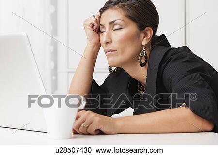 USA, Illinois, Metamora, mature woman sleeping on desk View Large Photo Image Stock Image - USA, Illinois, Metamora, mature woman sleeping on desk. Fotosearch