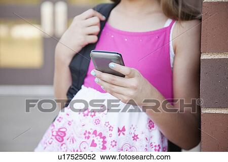 USA, Illinois, Metamora, Midsection of girl text-messaging View Large Photo Image Stock Image - USA, Illinois, Metamora, Midsection of girl text-messaging. Fotosearch