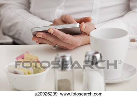 USA, Illinois, Metamora, Midsection of woman using tablet pc View Large Photo Image Stock Photo - USA, Illinois, Metamora, Midsection of woman using tablet pc. Fotosearch