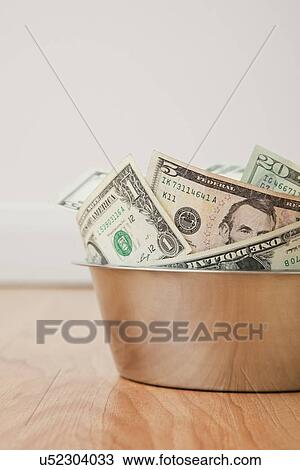 USA, Illinois, Metamora, Money in pet bowl View Large Photo Image Stock Image - USA, Illinois, Metamora, Money in pet bowl. Fotosearch