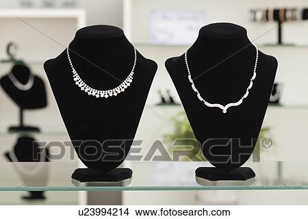 USA, Illinois, Metamora, necklaces on display in jewelry store View Large Photo Image Picture - USA, Illinois, Metamora, necklaces on display in jewelry store. Fotosearch