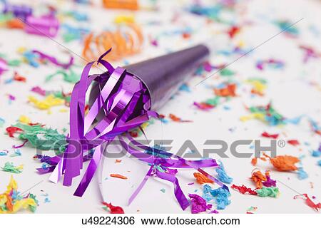 Stock Photograph - USA, Illinois, Metamora, Noisemaker with confetti. Fotosearch