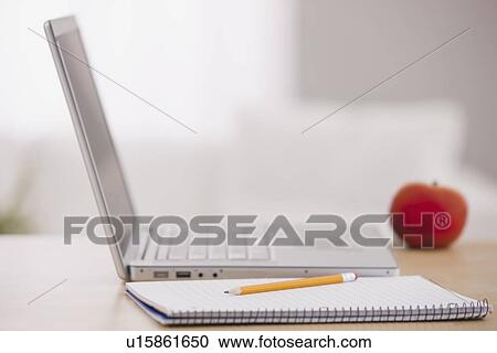 USA, Illinois, Metamora, Open laptop, notebook and pencil on desk View Large Photo Image Stock Image - USA, Illinois, Metamora, Open laptop, notebook and pencil on desk. Fotosearch