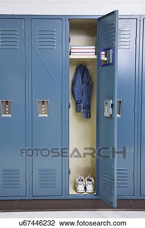 Stock Image - USA, Illinois, Metamora, Open locker in school. Fotosearch