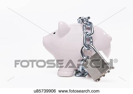 Stock Photograph - USA, Illinois, Metamora, Padlocked piggy bank. Fotosearch