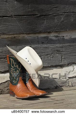 USA, Illinois, Metamora, Pair of cowboy boots and cowboy hat View Large Photo Image Stock Photo - USA, Illinois, Metamora, Pair of cowboy boots and cowboy hat. Fotosearch