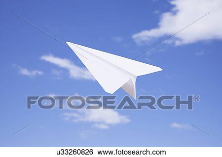 Stock Photograph - USA, Illinois, Metamora, Paper plane in flight. Fotosearch