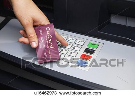 USA, Illinois, Metamora, Person using ATM View Large Photo Image Stock Image - USA, Illinois, Metamora, Person using ATM. Fotosearch
