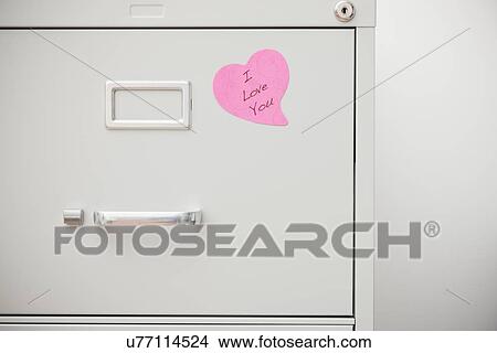 USA, Illinois, Metamora, Pink heart on filing cabinet View Large Photo Image Picture - USA, Illinois, Metamora, Pink heart on filing cabinet. Fotosearch