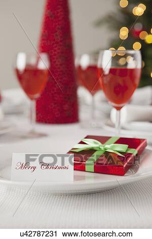 Stock Image - USA, Illinois, Metamora, Plate with small gift and greeting card. Fotosearch