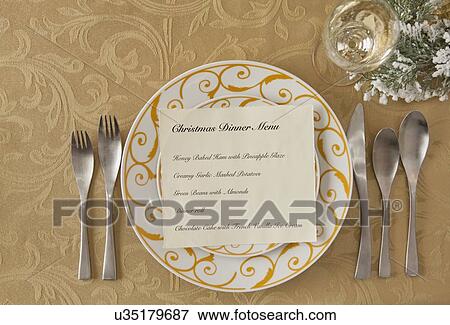 Stock Photo - USA, Illinois, Metamora, Plate with menu on Christmas table. Fotosearch